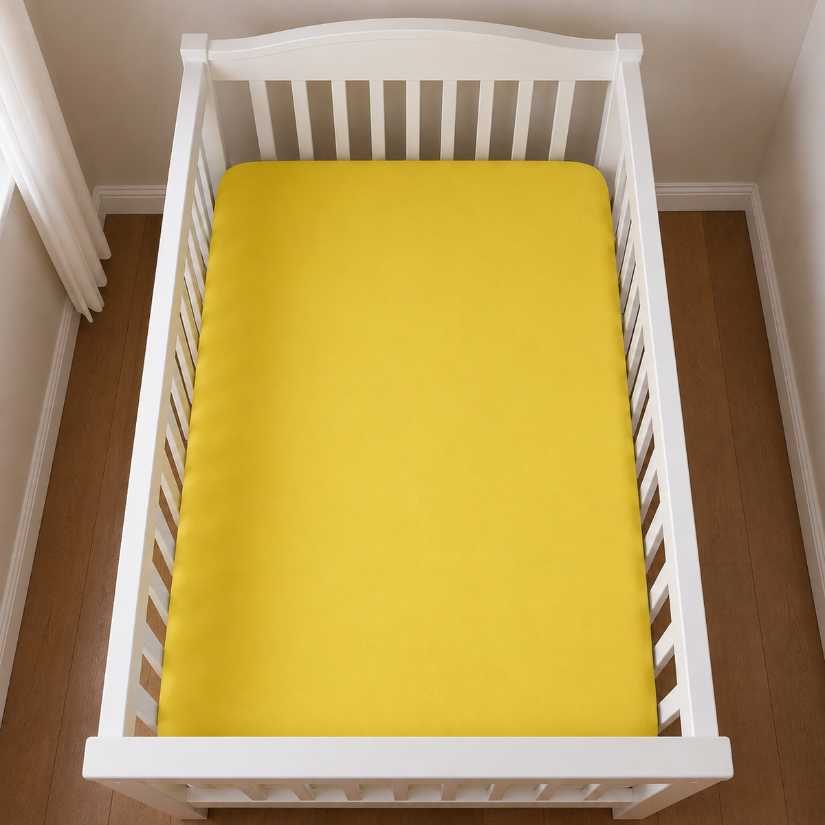2er Set Baby Jersey Spannbetttuch 60x120 cm - 70x140 cm Gelb Baumwolle aus der Vogelperspektive in einem Babybett dargestellt