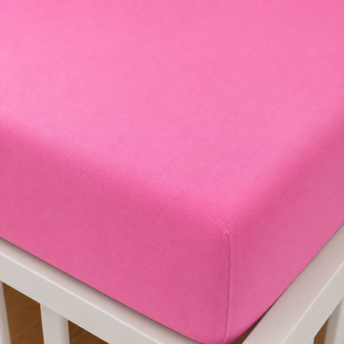 Nahaufnahme einer Ecke vom 2er Set Baby Jersey Spannbetttuch 60x120 cm - 70x140 cm Blütenrosa Baumwolle