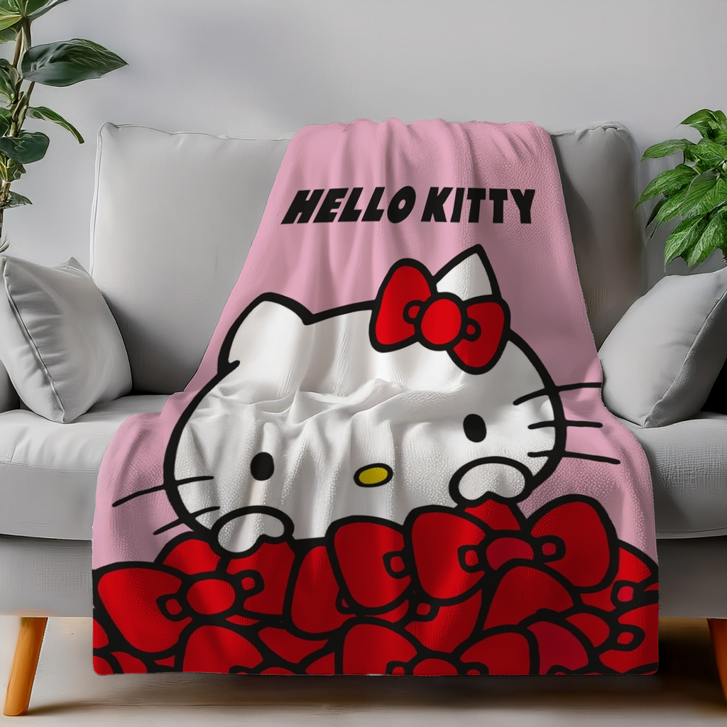 Hello Kitty Wohndecke Flauschdecke Kuscheldecke 130 x 160 cm auf einer Couch