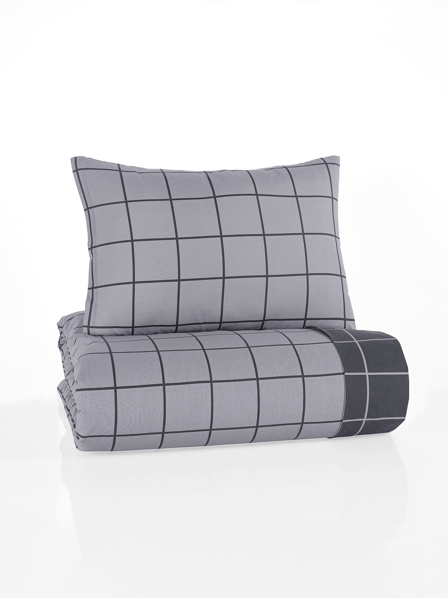 Gefaltetes Bettwäsche‑Set in Hellgrau mit dunkelgrauem Karomuster aus feinen Linien. Kissen und Decke im gleichen modernen Rasterdesign.