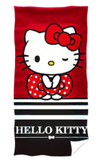 Handtuch mit Hello Kitty, roter Schleife und schwarz‑weißen Streifen. Unten weißer „HELLO KITTY“ Schriftzug auf schwarzem Feld.