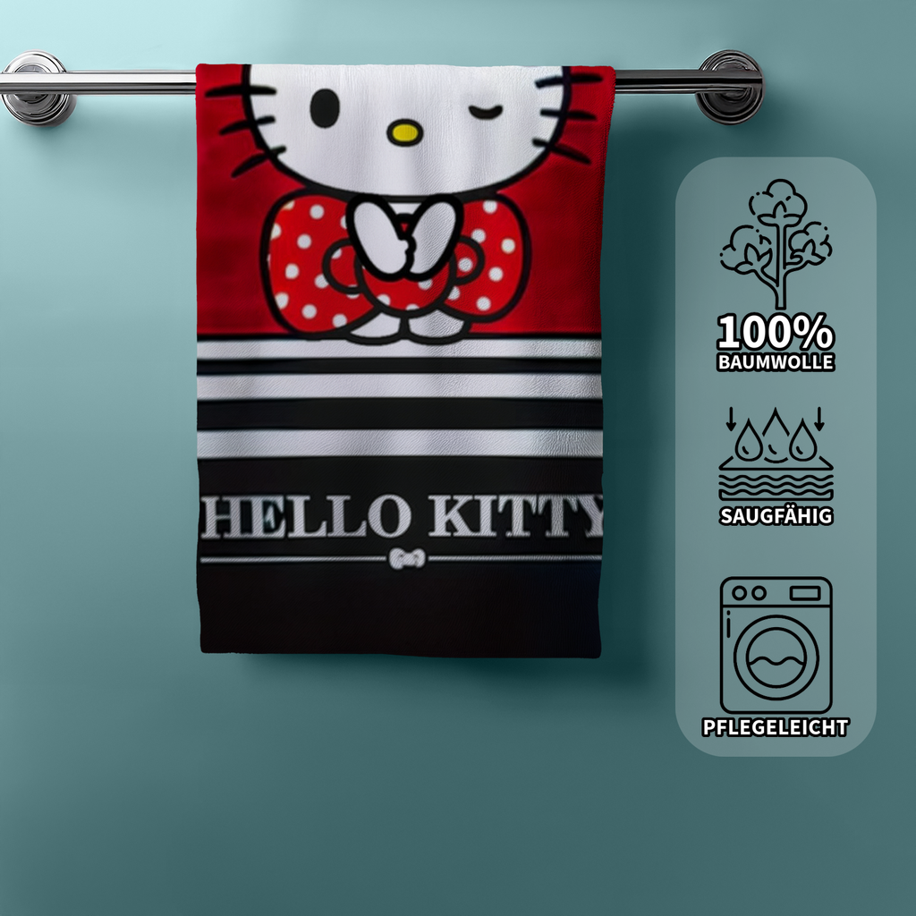 Hello‑Kitty‑Handtuch hängend, roter Hintergrund, Streifen, Kitty mit Schleife. Rechts Icons: 100% Baumwolle, saugfähig, pflegeleicht.