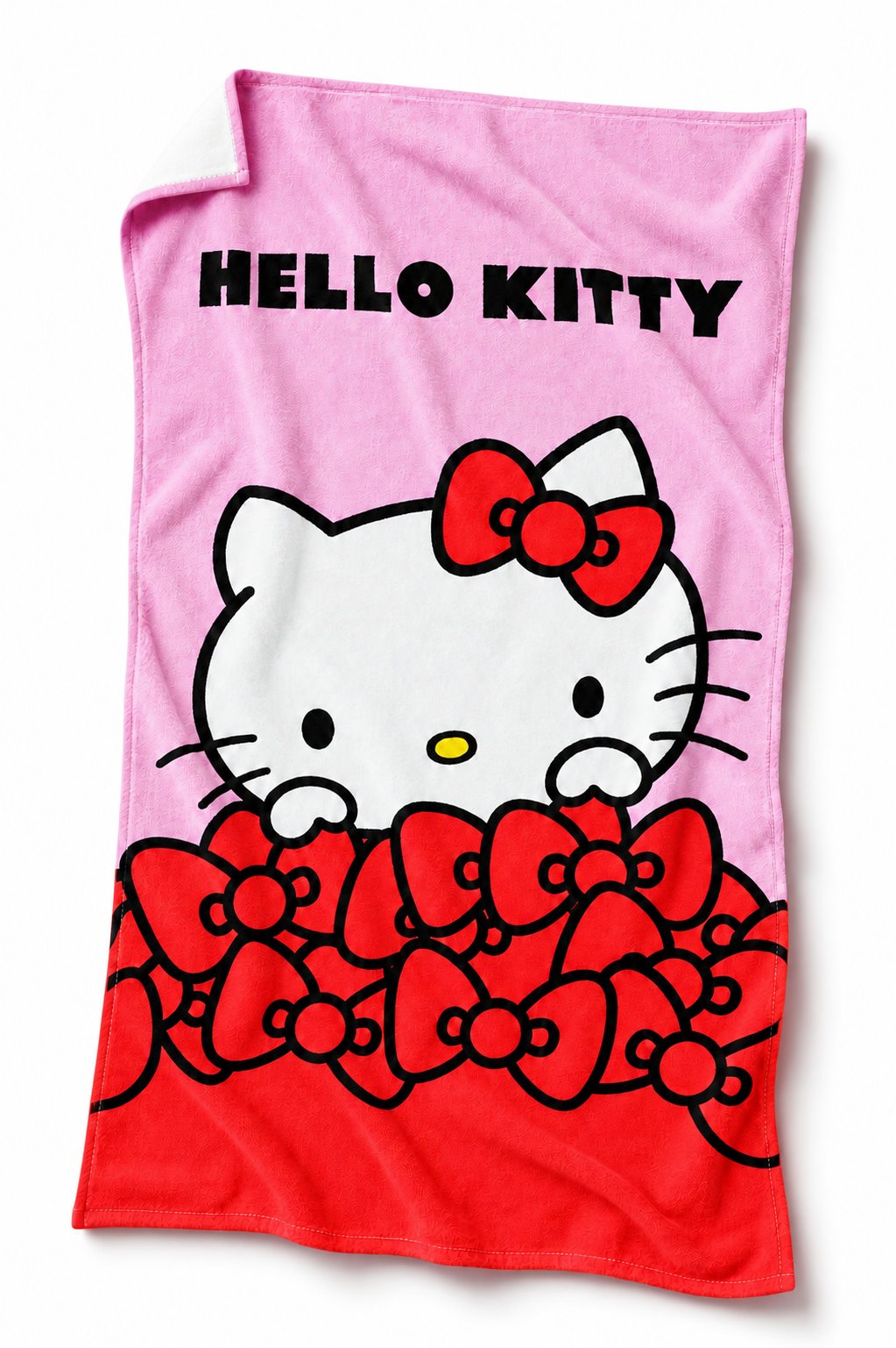 Freigestellte Produktansicht vom Hello Kitty Duschtuch Badetuch Strandtuch 90 x 170 cm / 100% Baumwolle. Die umgeschlagene Rückseite ist zum Teil sichtbar.