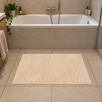 Badematte Badteppich Duschvorleger 60 x 100 cm Rechteckig Welle Beige auf dem Boden vor einer Badewanne
